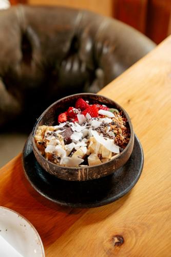 a bowl of food sitting on a table at Maison Italia 1029 in Santiago
