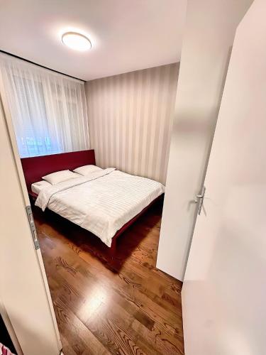 Ένα ή περισσότερα κρεβάτια σε δωμάτιο στο Apartman The Bo