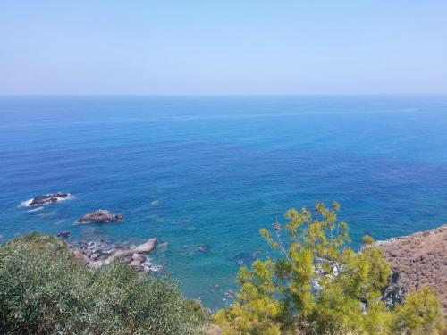 a view of the ocean from a cliff at Villa Best Holiday- breathtaking sea views, amazing garden, private pool, BBQ, next to CORAL BAY, Lower Peyia, Paphos in Peyia