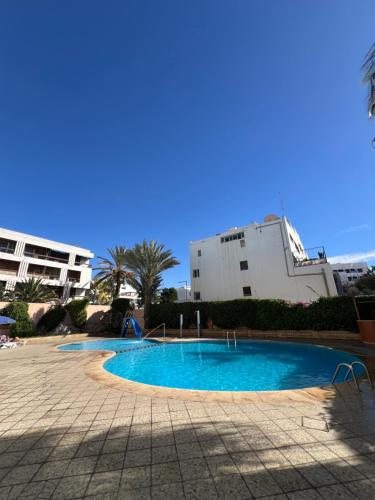 a small swimming pool in front of a building at Hôtel Résidence Louban in Agadir