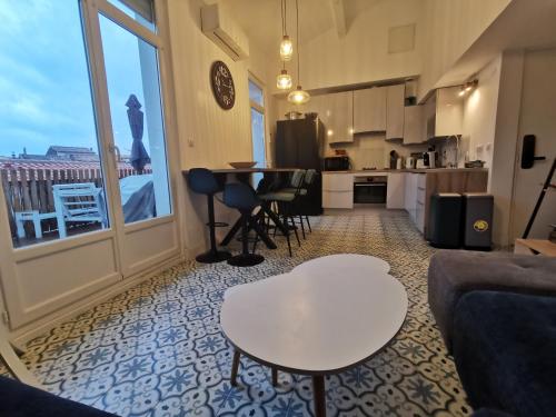 Cucina o angolo cottura di T3 terrasse classé 4 étoiles le Poulpe 200m front de mer