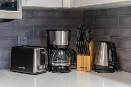 a kitchen counter with a coffee maker and a toaster at Cozy Orlando Getaway with Pool Access in Orlando