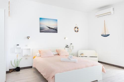 Кровать или кровати в номере Domus Playa Paraiso