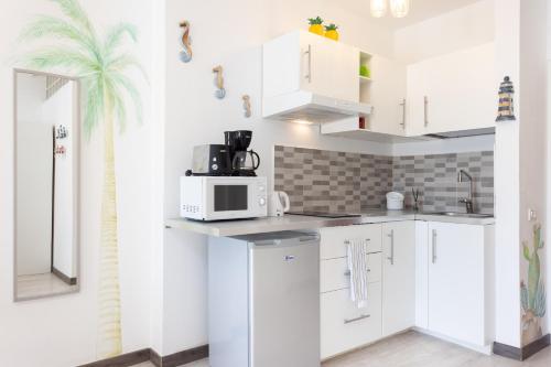 Кухня или мини-кухня в Domus Playa Paraiso
