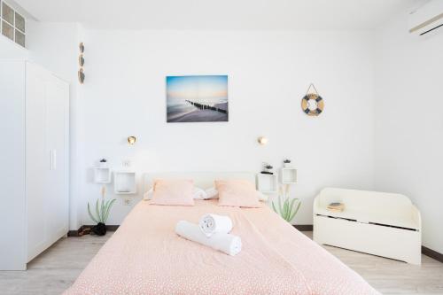 Кровать или кровати в номере Domus Playa Paraiso