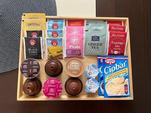a tray filled with different types of snacks and chocolateuts at Zen Suite in Novi Beograd