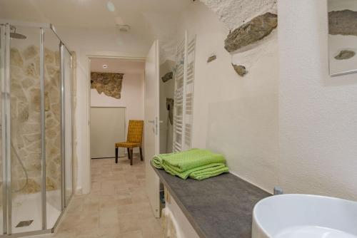 a bathroom with a sink and a shower and a counter at RivieraRent Dadda House in Orco Feglino