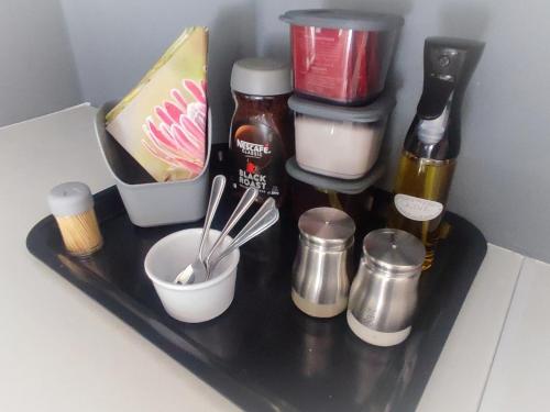 a shelf in a refrigerator filled with condiments at Summerwine self catering cottage in Montagu