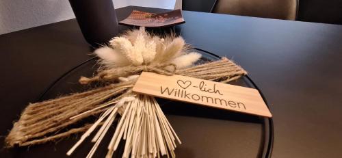 a glass table with a sign that says hello willuminati at Haus Alpenblick in See