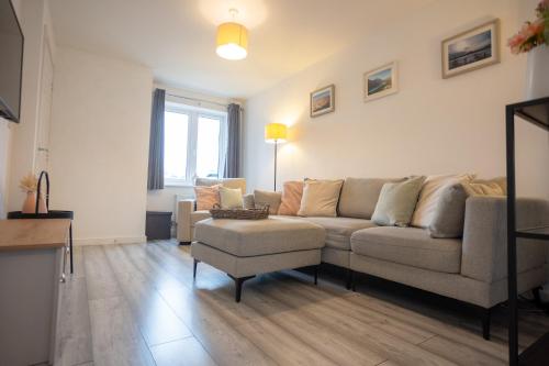 a living room with a couch and a chair at The Getaway in West Monkton