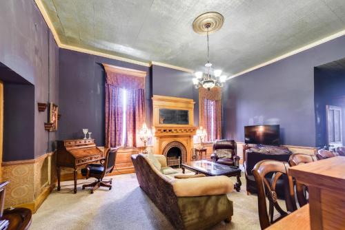 a living room with a couch and a fireplace at Yankton Apt 1 Mi to Mount Marty University! in Yankton