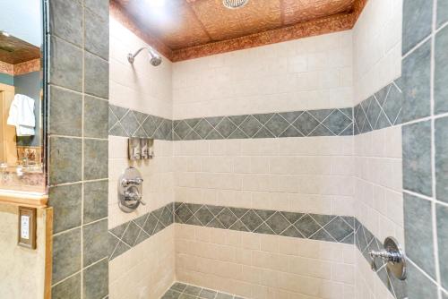 a bathroom with a shower with a sink at Yankton Apt 1 Mi to Mount Marty University! in Yankton