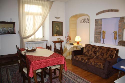 a living room with a couch and a table at City's House Guest House in Bergamo