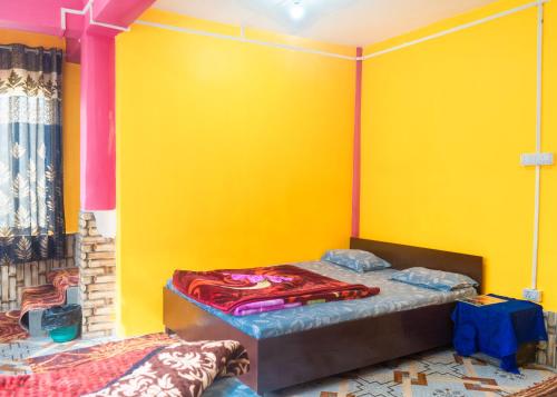 Ένα ή περισσότερα κρεβάτια σε δωμάτιο στο DP Homestaayz By StayApart