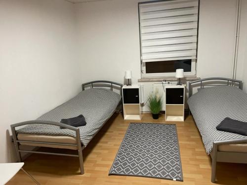 Ένα ή περισσότερα κρεβάτια σε δωμάτιο στο LocalBeds - Ferienwohnung Monteurwohnung