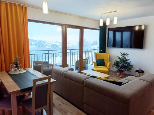 Μια τηλεόραση ή/και κέντρο ψυχαγωγίας στο Apartamenty Kaniówka 25