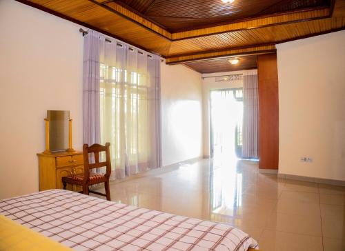 Voodi või voodid majutusasutuse The Vista Homes Kibagabaga toas