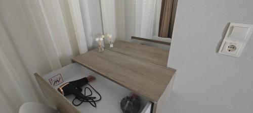 a small room with a wooden table with candles at Marina Studio Appartments in Kardamaina