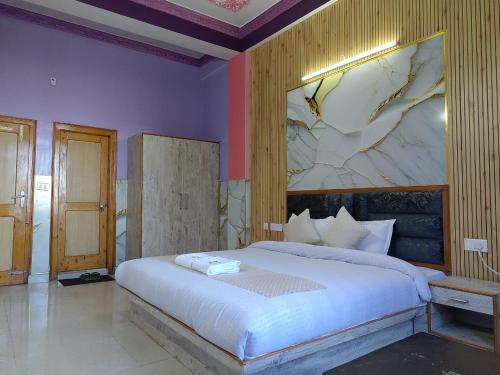 Postel nebo postele na pokoji v ubytování Hotel Ashoka B&B