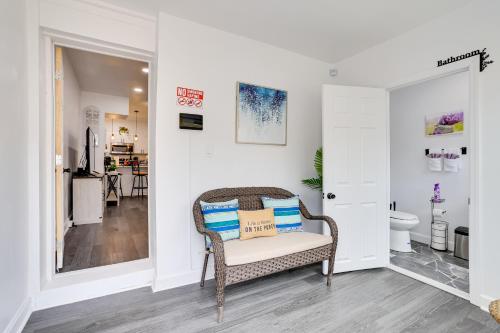 a living room with a chair and a bathroom at Philly Hub Near World Cup and Downtown Attractions! in Philadelphia