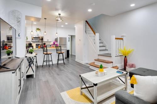 a living room with a couch and a table at Philly Hub Near World Cup and Downtown Attractions! in Philadelphia