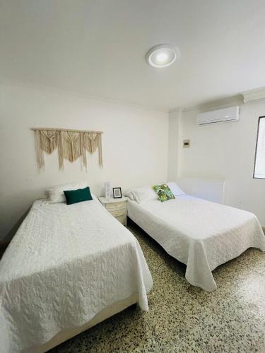 Katil atau katil-katil dalam bilik di Loft Vista al Laguito