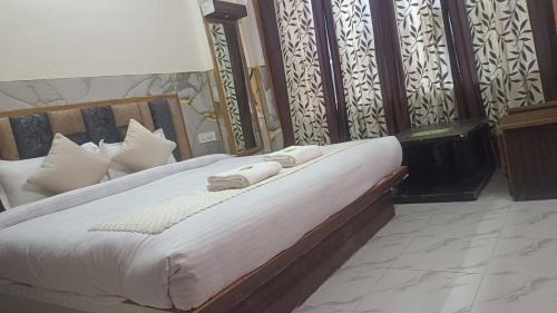 Ένα ή περισσότερα κρεβάτια σε δωμάτιο στο Hotel Ashoka B&B