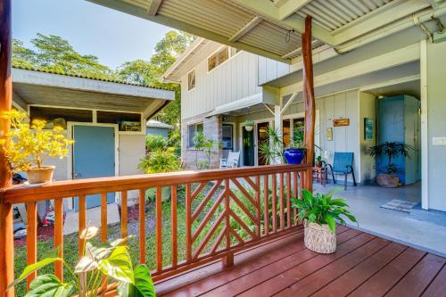 a porch of a home with a wooden deck at Keaau Apartment on Beautiful Acre with Pool and Deck! in Keaau
