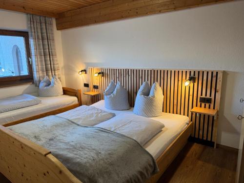 Posteľ alebo postele v izbe v ubytovaní Gästehaus Garber