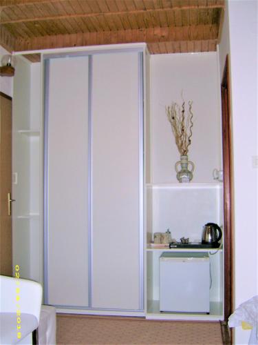 a large white cabinet in a room at Vila Vuk 1 in Plitvička Jezera