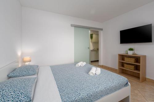 Idyllisches Apartment nur 600 Meter zum Strand mit privater Terrasse, WiFi, Parkplatz