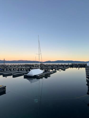a sailboat is docked at a dock in the water at The Aspen House in Tahoma