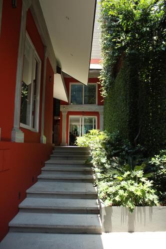 a set of stairs leading to a building at Casa Fontana Suites in Mexico City