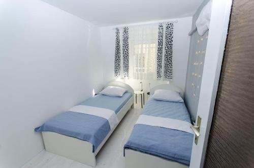 Modernes Apartment nur 350 Meter zum Strand mit privater Terrasse, Babybett, Elektrogrill