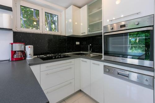 Beeindruckendes Apartment direkt am Strand mit privater Terrasse, Privatparkplatz, WiFi, Grill