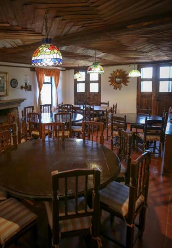 a dining room with a large table and chairs at Rancho Yapalpan in El Oro de Hidalgo