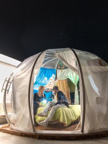 a group of people sitting in a tent at Oasi della pace in Bisceglie