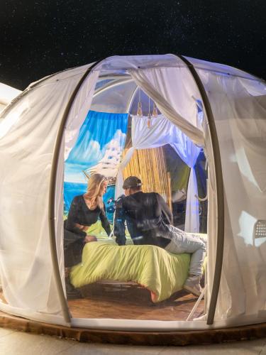 two people in a iguana tent at Oasi della pace in Bisceglie