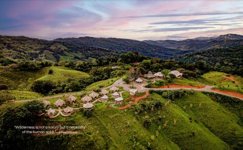 an aerial view of a resort in the mountains at Eco Luxe Glamping Tent - King Bed at Holos in Barú