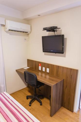 TV a/nebo společenská místnost v ubytování JR Hotel Ribeirão Preto