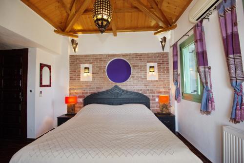 Кровать или кровати в номере Villa Theros