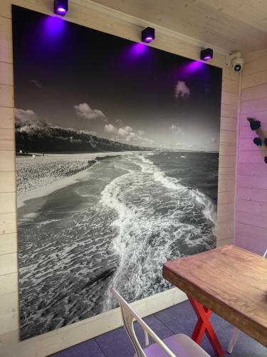 a room with a table and a view of the ocean at Loox Ostrovo- Boutique House-noclegi nad morzem in Ostrowo
