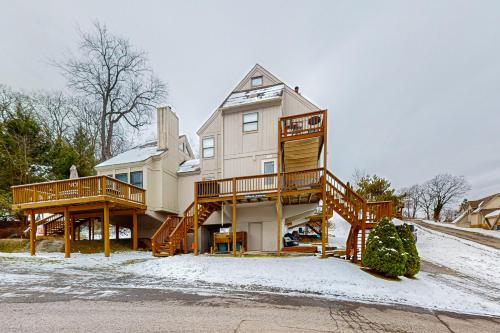 a large house with wooden decks in the snow at Jeffrey Lane Condos in Thayerville