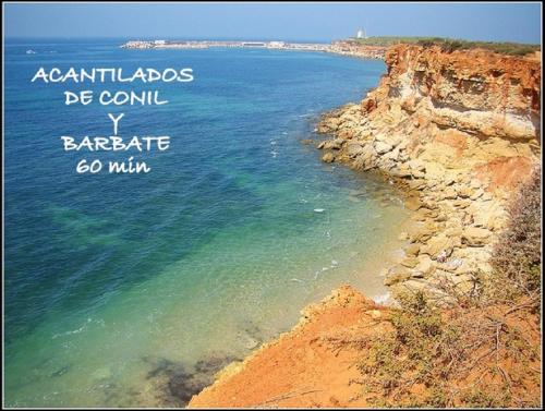 a picture of the ocean with the words australias be commin v bar at Acogedor loft a 30 minutos de la playa y montaña in Lebrija