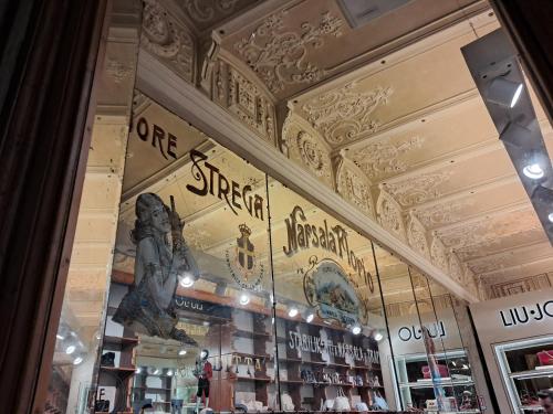 a store window of a store with a sign in it at Hotel Minerva in Siena