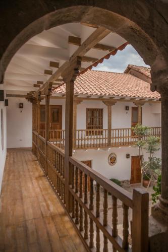 a balcony of a house with an archway at Casa Clara by Ananay Hotels in Cusco