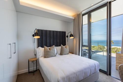 Ένα ή περισσότερα κρεβάτια σε δωμάτιο στο Plett Quarter Apartments