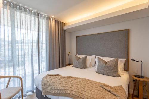 Ένα ή περισσότερα κρεβάτια σε δωμάτιο στο Plett Quarter Apartments