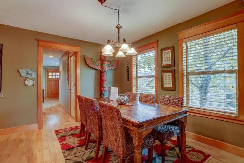 a dining room with a wooden table and chairs at Wanderlust in Hood River