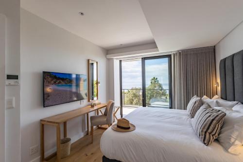 Ένα ή περισσότερα κρεβάτια σε δωμάτιο στο Plett Quarter Apartments